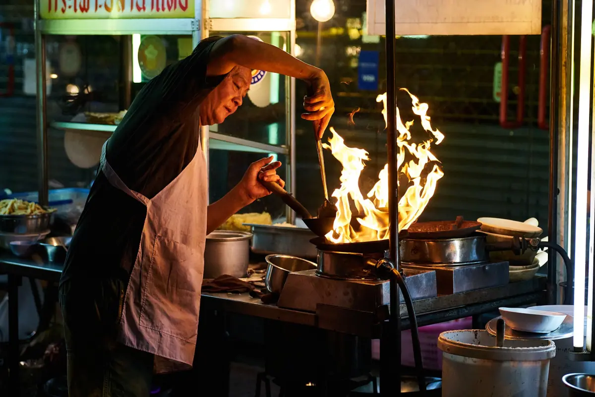 Cooking at a street kitchen in Chinatown