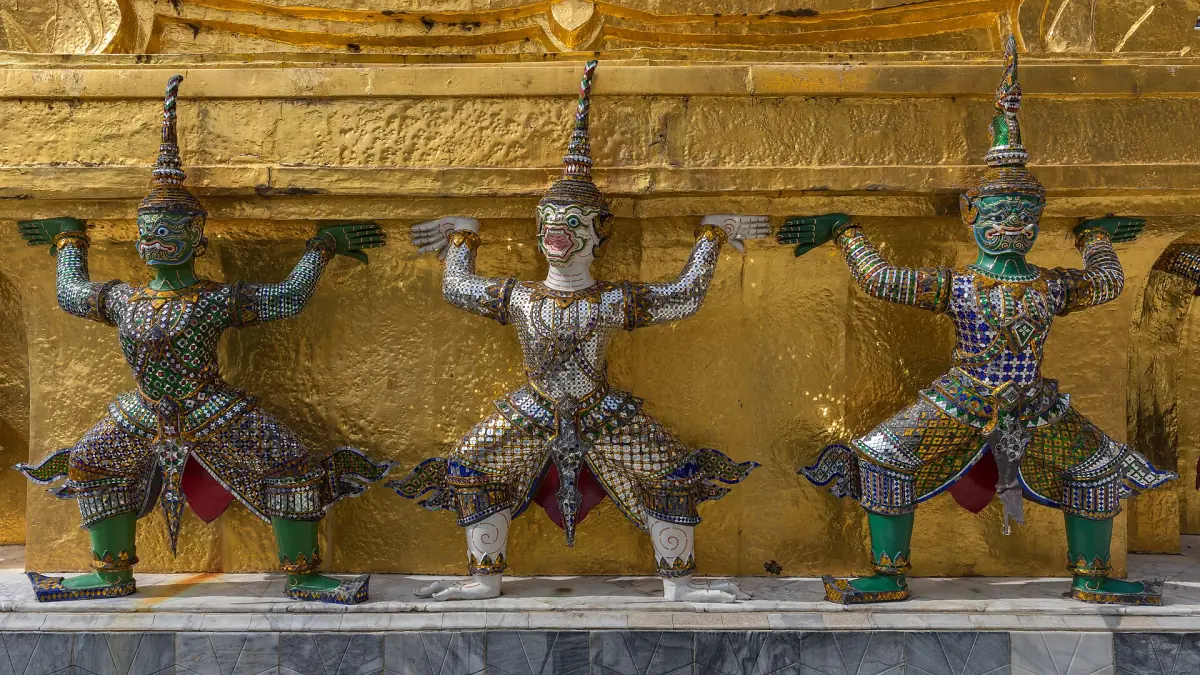 Yaksha statues supporting a golden chedi
